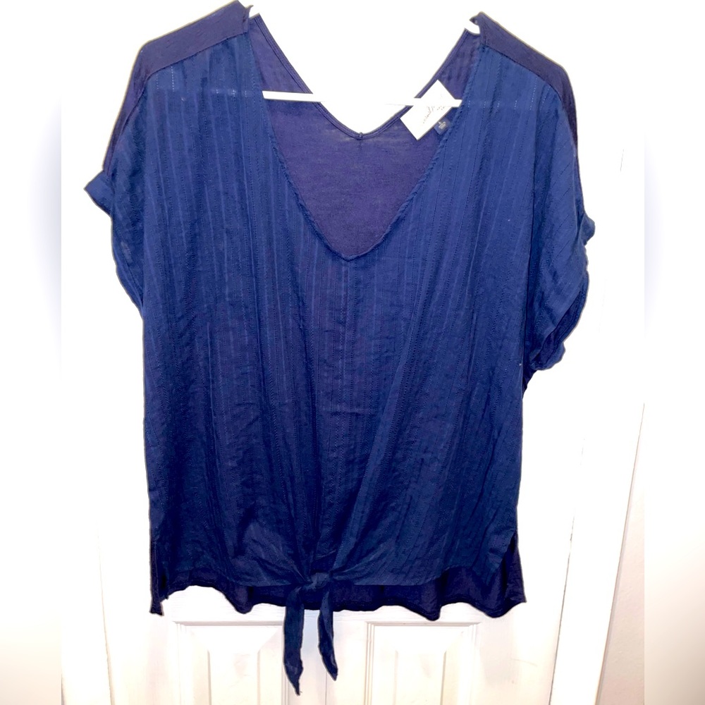 Navy blue tie in front blouse.